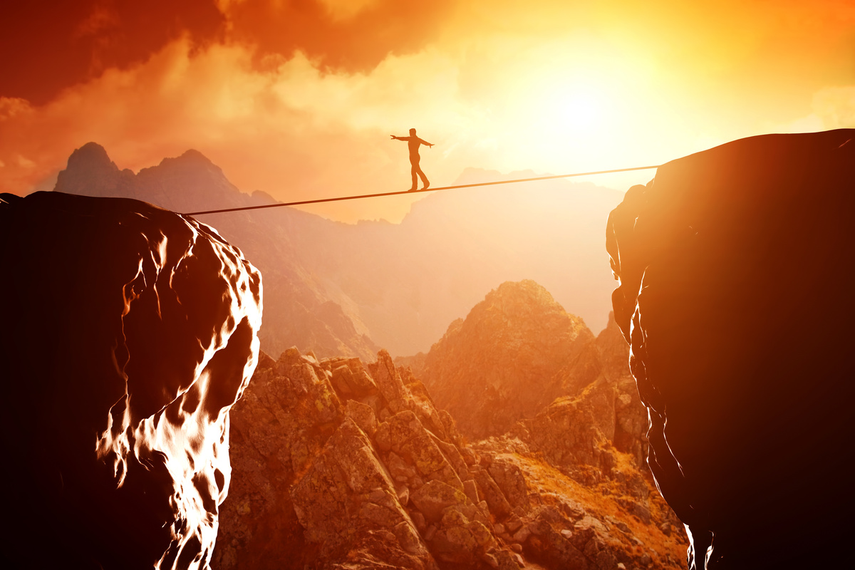 Man Walking and Balancing on Rope